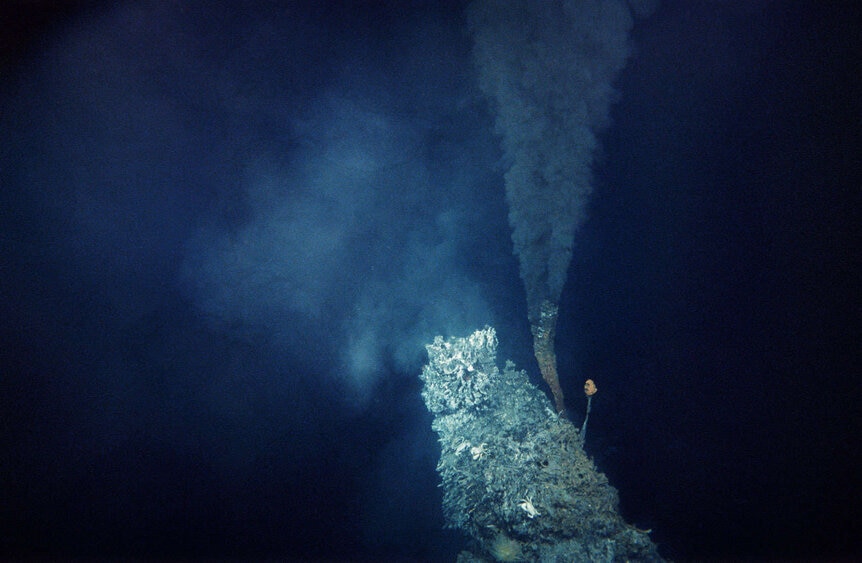 An example of a “black smoker”, a very hot hydrothermal event emitting chemicals due to tectonic activity far below. Despite the conditions, life thrives near these vents. Credit: Getty Images / Ralph White