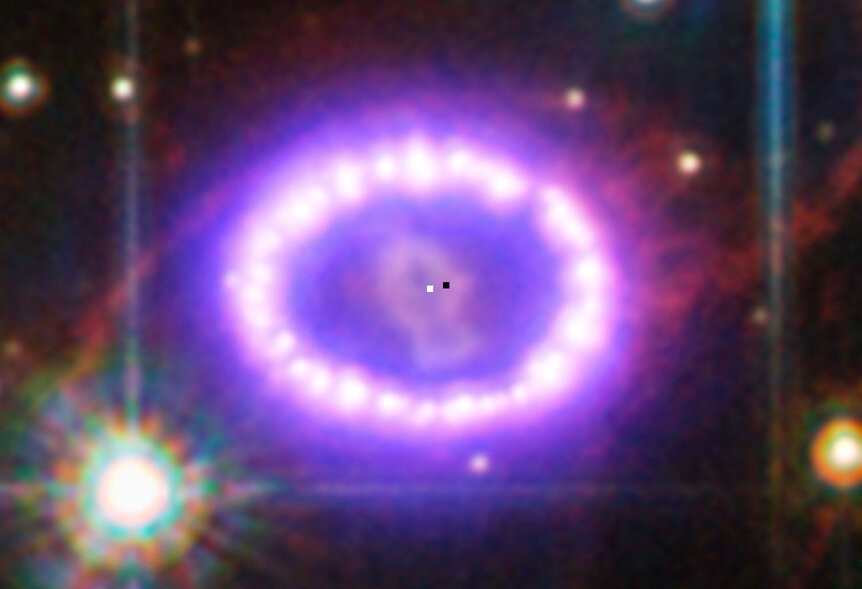 The possibly location of the neutron star left over from Supernova 1987A is marked by a black square, just to the upper right of the actual center of the ring (white square) where the explosion occurred. 