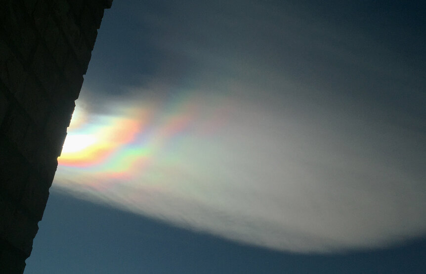 An iridescent cloud over Boulder, Colorado. The droplets near the edges of clouds like this are very tiny and all about the same size; with the Sun nearly behind them that sets up perfect conditions for iridescence. Credit: Phil Plait