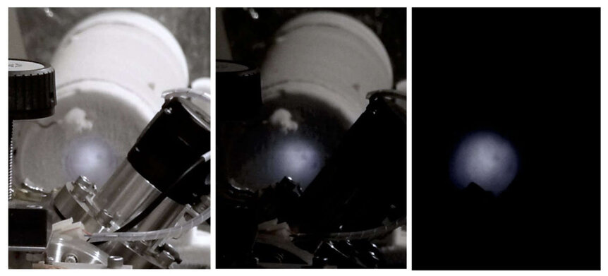 The glow of irradiated ice in the experiment was obvious even by eye. The left panel shows the equipment and glowing ice with the lab lights on (left), dimmed (middle) and off (right). Credit: Gudipati et al.