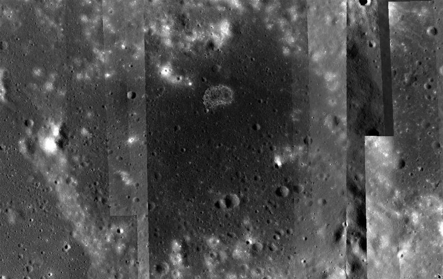 The lunar irregular mare patch Ina, a weird formation that is likely volcanic in origin, but more than that no one can say. The strips are a processing artifact; this is a mosaic of many images. Credit: NASA/GSFC/Arizona State University / Quickmap