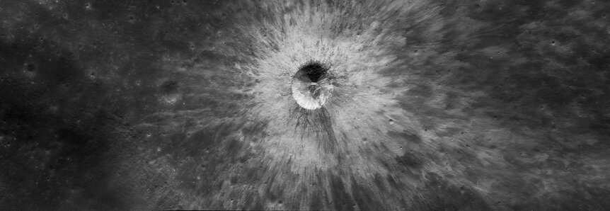 An unnamed crater, young and fresh, near the western edge of the Moon’s near side.  Credit: NASA/GSFC/Arizona State University