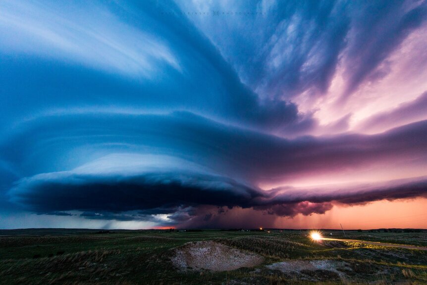 A spectacular thunderstorm sports a mesocyclone (left), a rotating structure that can spawn tornadoes. Credit: Mike Olbinski