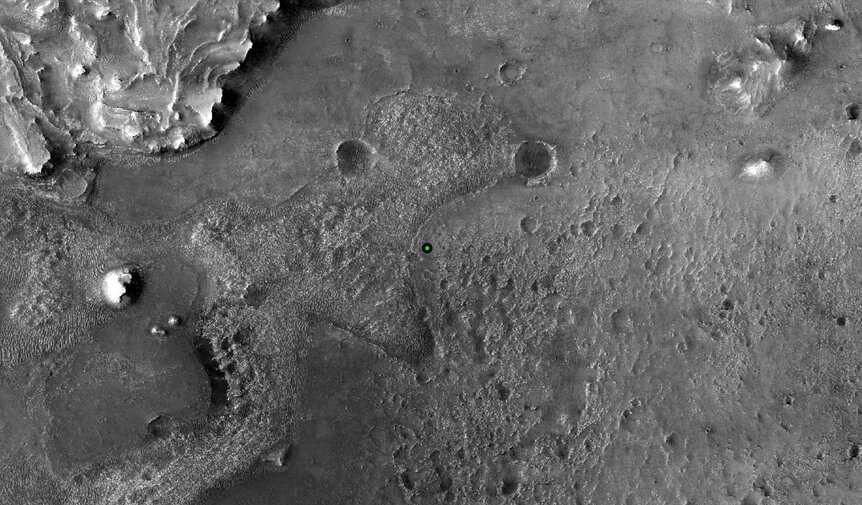 The landing spot (green and black circle) of the Mars rover Perseverance in Jezero crater. The formation at the upper left is the edge of a river delta where ancient water flow dumped sediment into the crater lake. Credit: NASA/JPL-Caltech/University of A