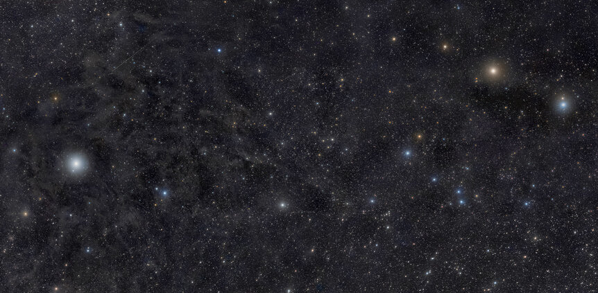 Ursa Minor — the Little Dipper — is gorgeous in this deep mosaic that shows thousands of stars, faint wisps of dust, and a brief interplanetary visitor. Credit: Rogelio Bernal Andreo