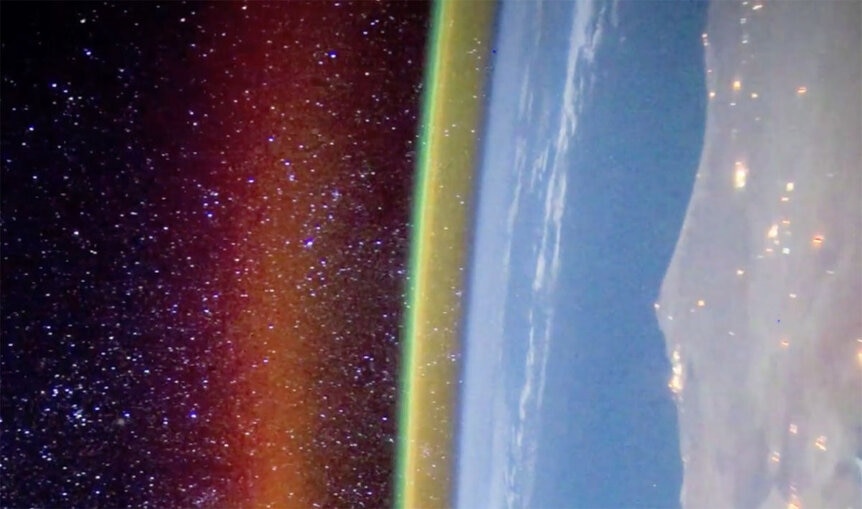 From the International Space Station, the atmosphere at night glows. Red and green are due to oxygen, and the yellow is from sodium, deposited by meteors as they burn up high above the ground. Credit: Alex Rivest