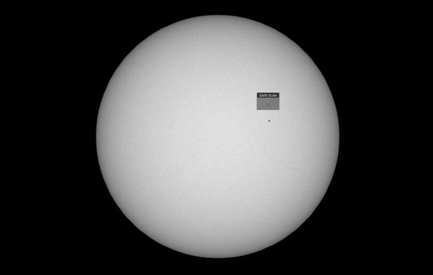 NASA’s space-based Solar Dynamics Observatory also saw the same sunspot on Jan. 28, 2020. The Earth is included as a size comparison. Credit: NASA/SDO/Helioviewer