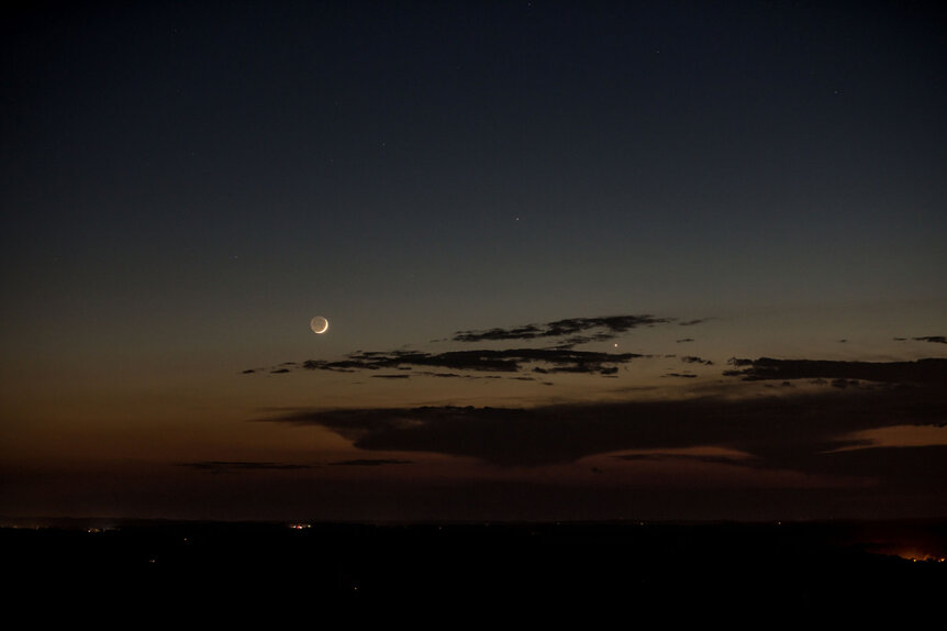 The original background picture taken for the "Moon and Andromeda" viral meme, showing the crescent Moon, Mercury (top center), and Venus (bottom right). Credit: Stephen Rahn&nbsp;