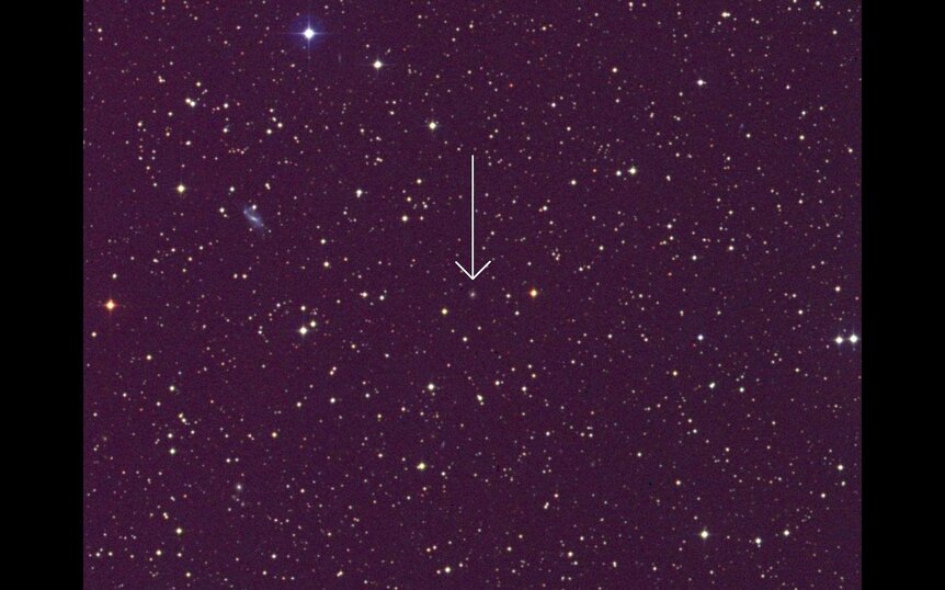 The host of the TDE AT 2019 dsg (arrowed) is an unassuming galaxy about 730 million light years away. Credit: NASA/GSFC/Skyview/DSS2