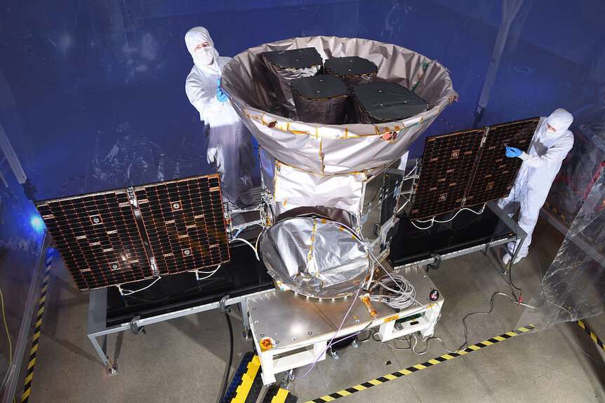 The TESS observatory being cared for by technicians before launch. Credit: NASA