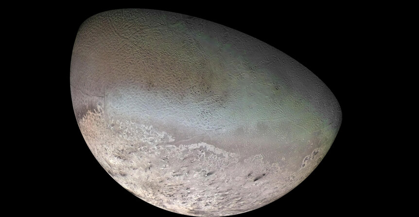 A mosaic of Neptune’s moon Triton created from Voyager 2 images during a flyby in 1989.  Note the black streaks near the bottom; evidence of geyser-like eruptions and wind. Credit: NASA/JPL/USGS