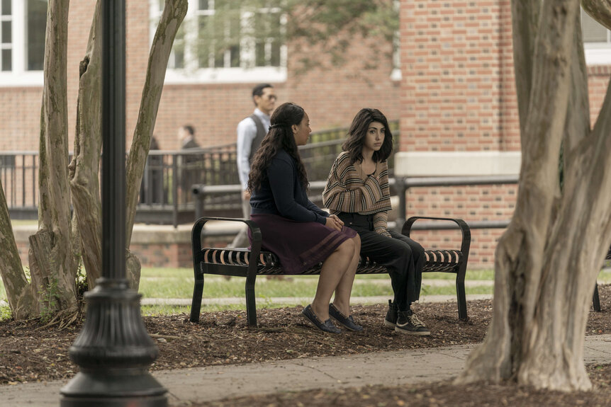 the walking dead world beyond episode 101 Hope and Iris sitting on a bench