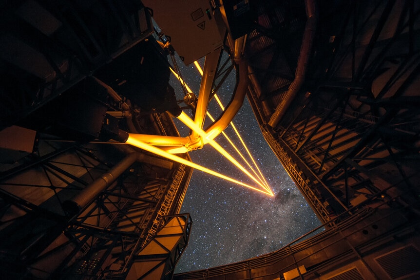 Four lasers beam into the sky to help sharpen images taken using the Very Large Telescope. Credit: ESO/F. Kamphues