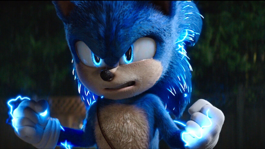 Sonic the Hedgehog clenching his fist and glowing blue.