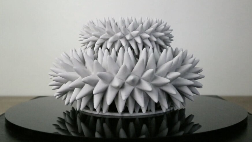 A 3D printed sculpture appears to wiggle and move when spun and lit by a strobe light on video. Credit: John Edmark, from the video