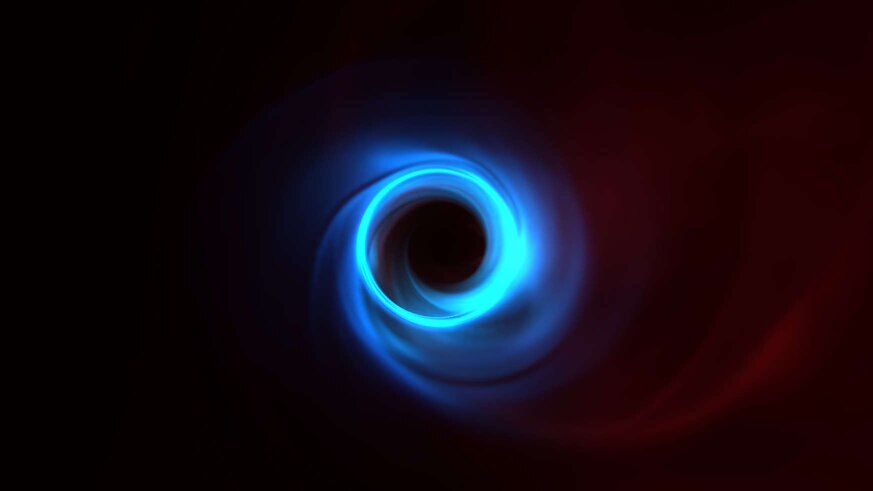 A simulation of the light emitted by material as it swirls around the black hole M87*. Red is long-wavelength radio waves, blue is millimeter-range waves (what the Event Horizon Telescopes sees), and green is near-infrared light.