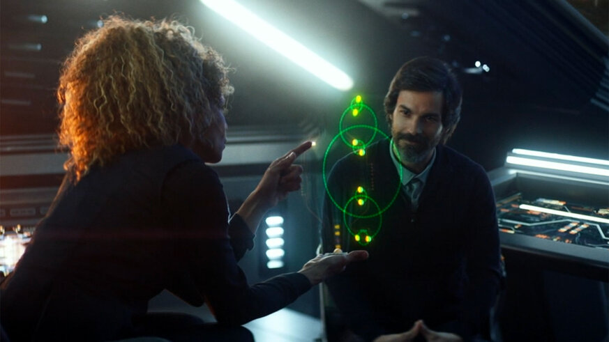 Raffi shows Enoch, the navigational hologram, a schematic of an octonary, an eight-star system, as shown in the Star Trek: Picard episode, “Broken Pieces”. Credit: CBS