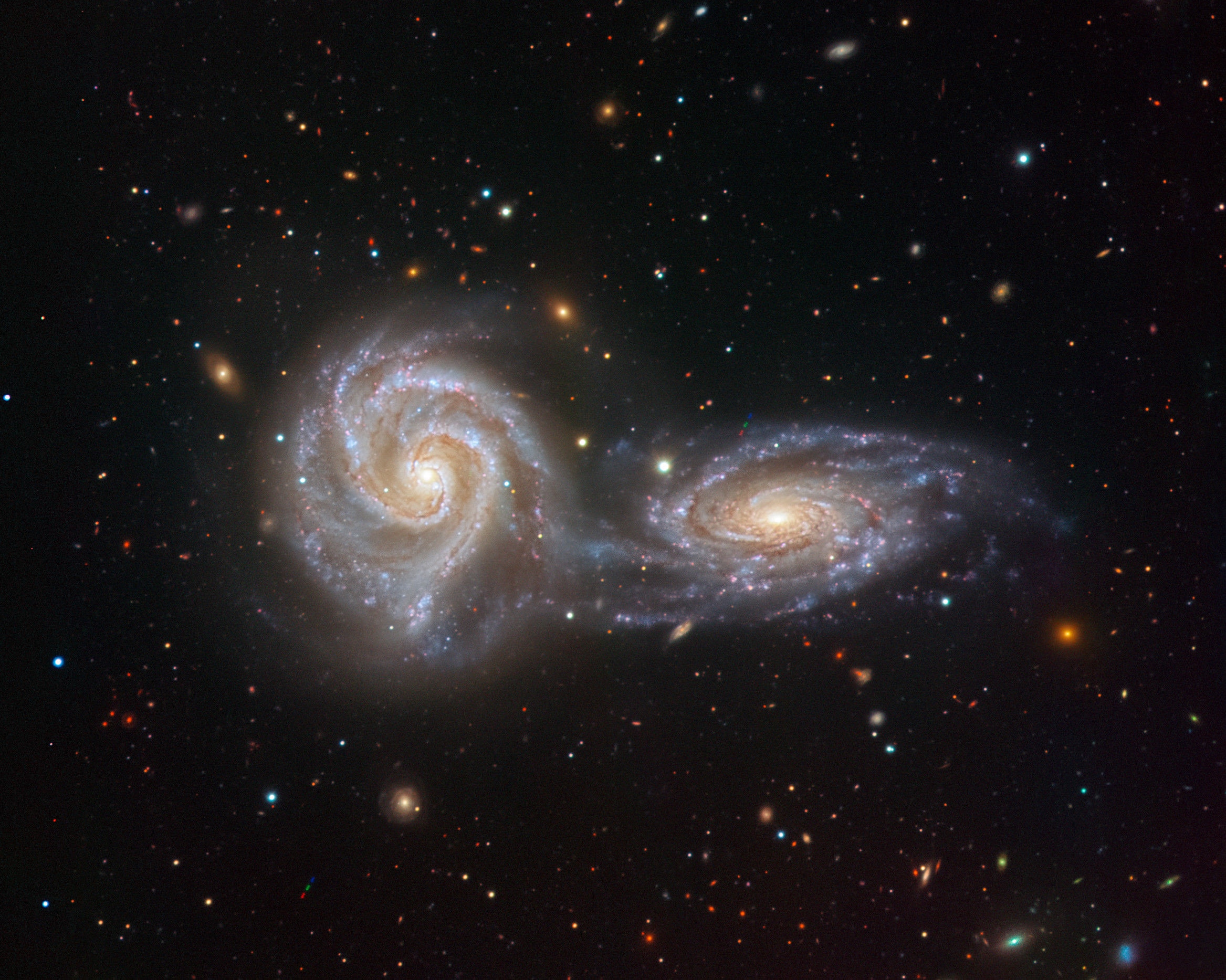 NGC 5426 (right) and NGC 5427 (left), together known as Arp 271, are close enough to each other to be interacting. Credit: ESO/Juan Carlos Muñoz​​​​​​​