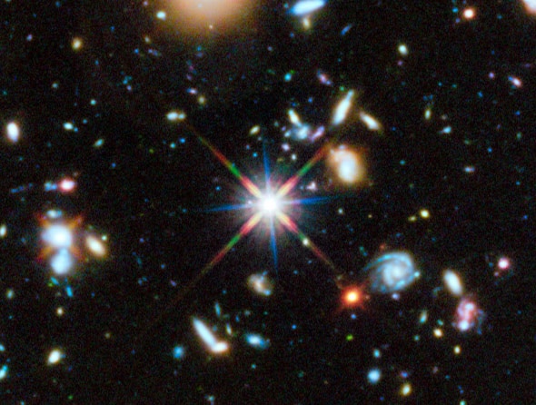 A small section of the Hubble ultraviolet portion of the Ultra Deep Field. That bright thing is a star in our own galaxy. Pretty much everything else in this shot is a whole galaxy, very very far away. Credit: NASA,ESA, H. Teplitz and M. Rafelski (IPAC/Ca