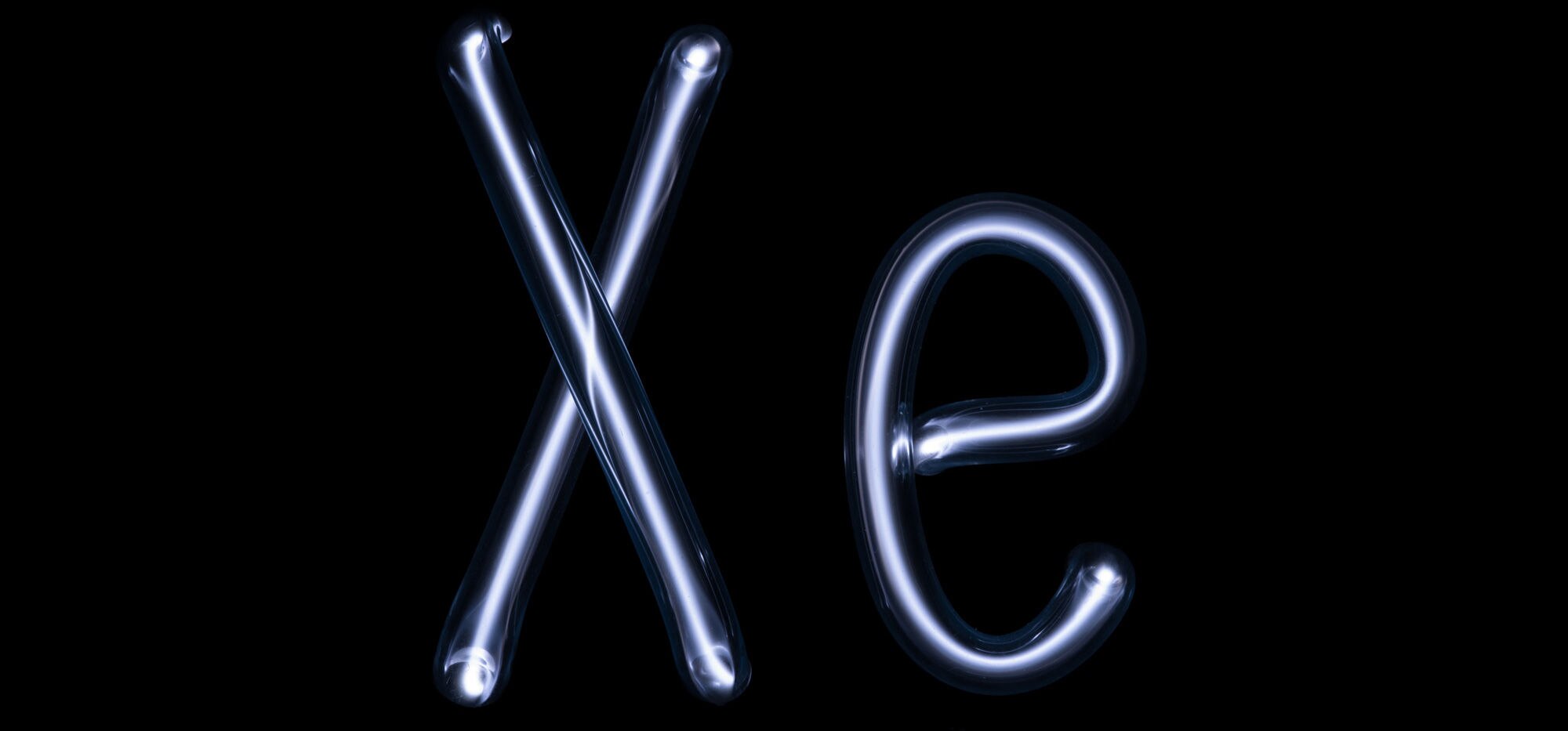Xenon glows blue when excited by an electric field. These glass tubes, shaped in xenon’s element symbol, are filled with xenon gas. This doesn’t have anything to do with the article, really, but I thought it was fun and clever. Credit: Pslawinski / wikipe