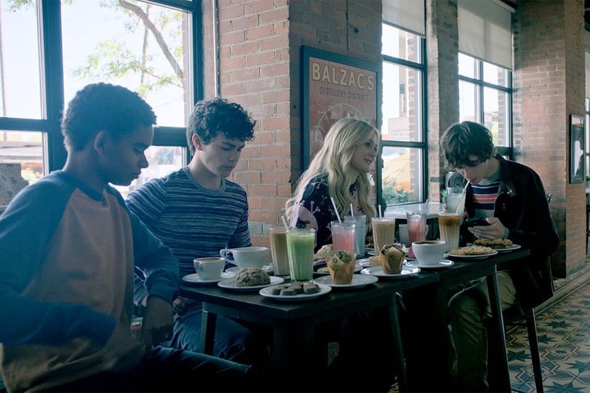(l-r) Devon Evans (Bjorgvin Arnarson), Jake Wheeler (Zachary Arthur), Lexy Cross (Alyvia Alyn Lind), and Grant Collins (Jackson Kelly) sit at a table full of food in Chucky 302 -- “Let the Right One In”
